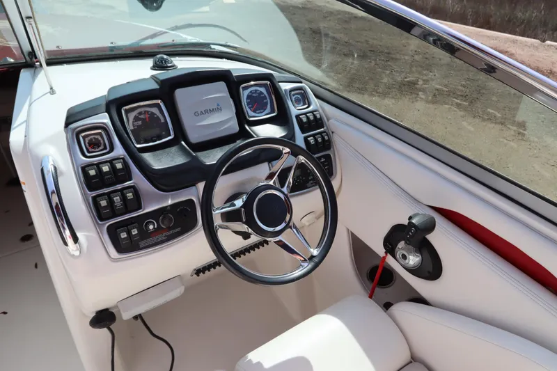 Slide: The Image of Steering console of 2016 Chaparral 287 SSX boat with Garmin navigation system. - 24