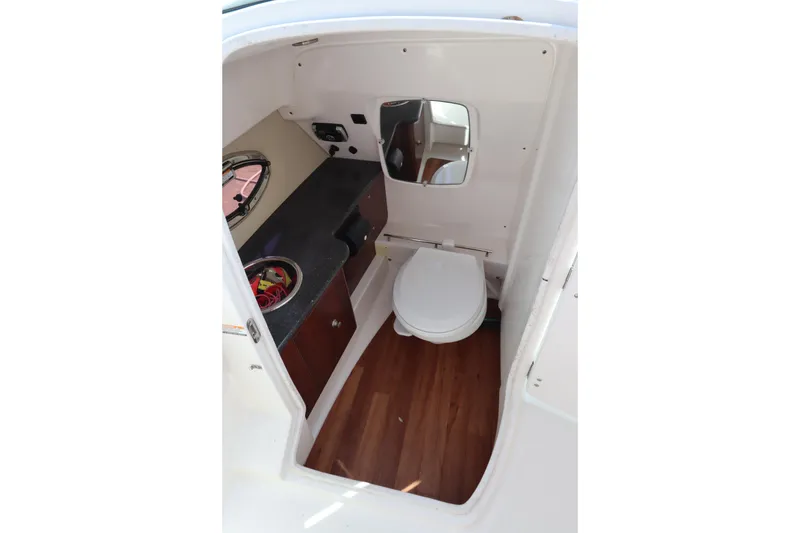 Slide: The Image of 2016 Chaparral 287 SSX boat interior with toilet and sink. - 25