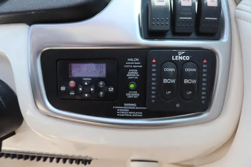 Slide: The Image of Control panel of a 2016 Chaparral 287 SSX boat with Clarion and Lenco systems. - 27