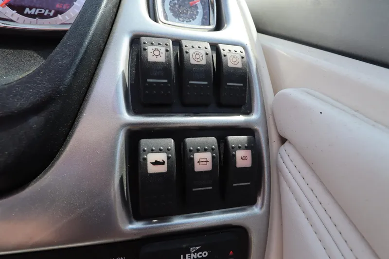 Slide: The Image of Control panel of a 2016 Chaparral 287 SSX boat with various switches. - 28