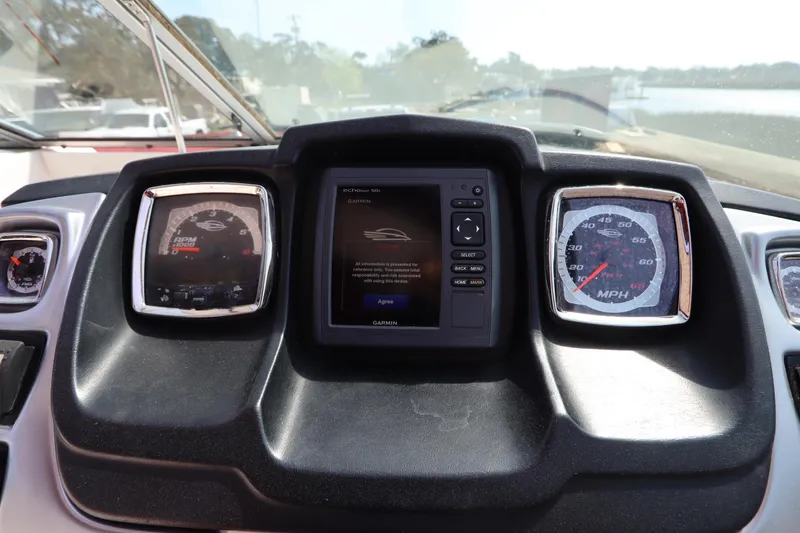 Slide: The Image of Dashboard of a 2016 Chaparral 287 SSX boat with gauges and Garmin display. - 31