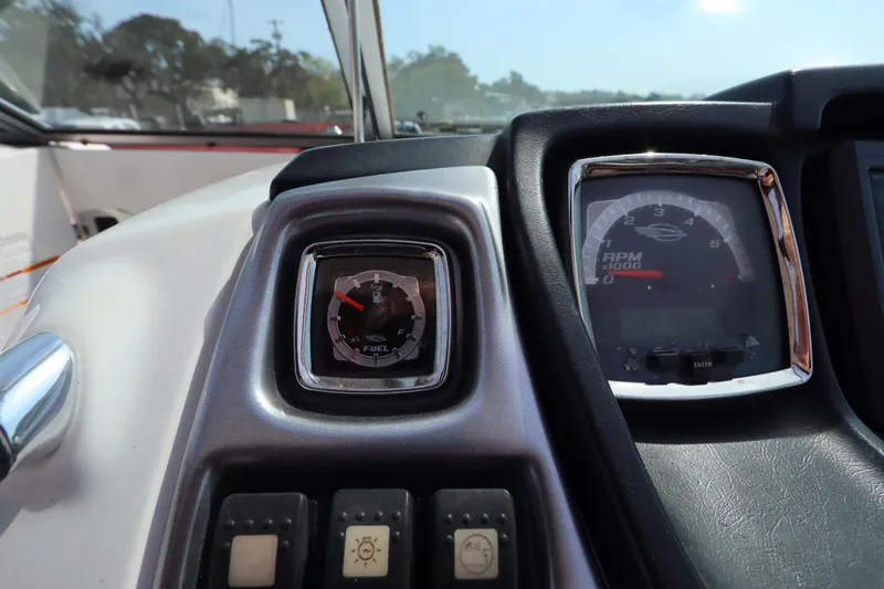 Slide: The Image of Dashboard of 2016 Chaparral 287 SSX boat showing fuel gauge and RPM meter. - 34