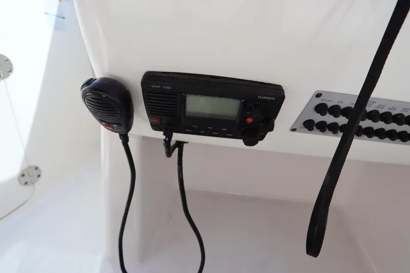 Slide: The Image of VHF radio and control panel on 2016 Chaparral 287 SSX boat. - 39