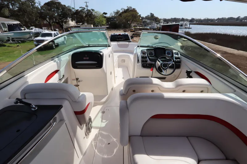 Slide: The Image of 2016 Chaparral 287 SSX boat interior with sleek dashboard and comfortable seating. - 42