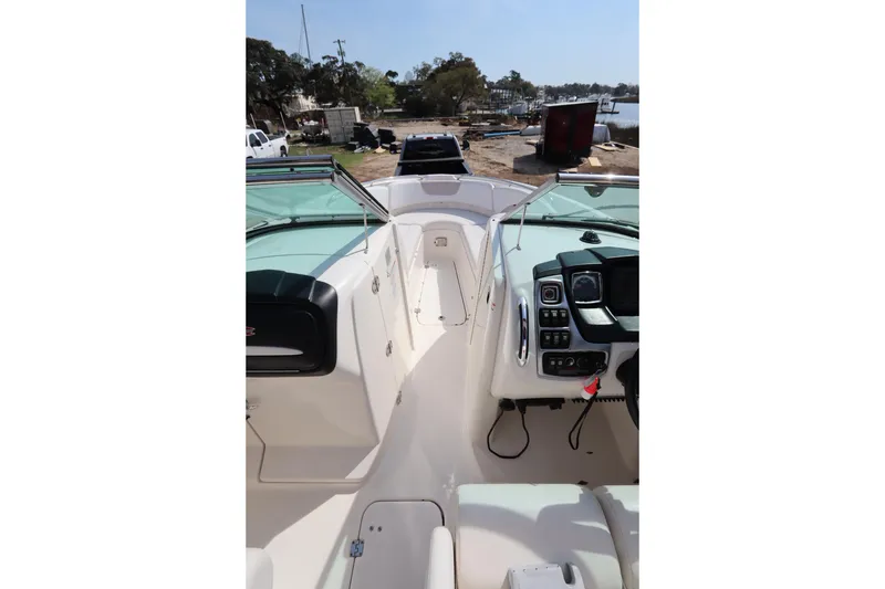 Slide: The Image of 2016 Chaparral 287 SSX boat interior with dashboard and seating area. - 43