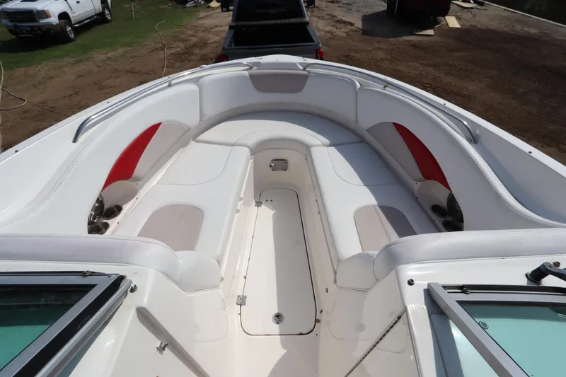 Slide: The Image of 2016 Chaparral 287 SSX boat interior with white and red seating. - 44