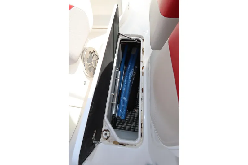 Slide: The Image of Storage compartment on 2016 Chaparral 287 SSX boat, featuring interior equipment. - 50