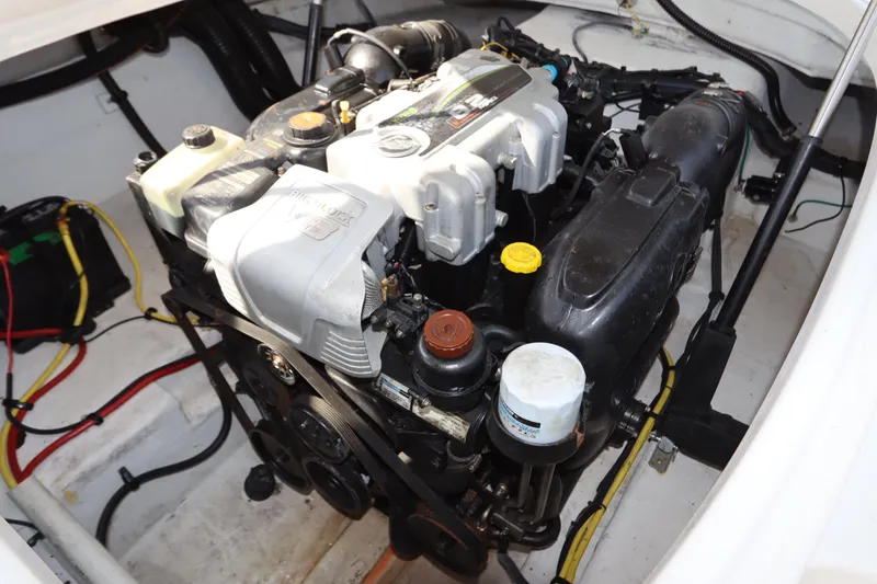 Slide: The Image of Engine compartment of 2016 Chaparral 287 SSX boat, showcasing detailed mechanical components. - 58