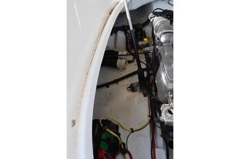 Slide: The Image of Engine compartment of a 2016 Chaparral 287 SSX boat, showing wiring and components. - 59