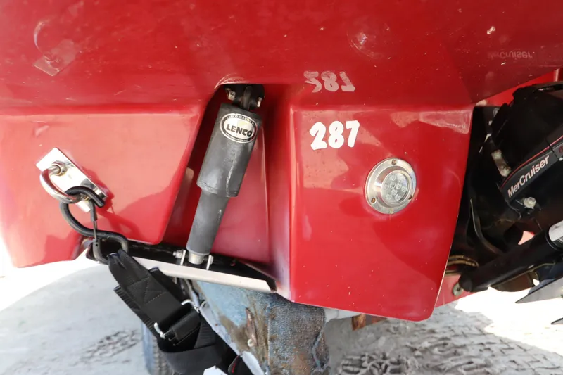 Slide: The Image of Rear view of a 2016 Chaparral 287 SSX boat with Lenco trim tab. - 6