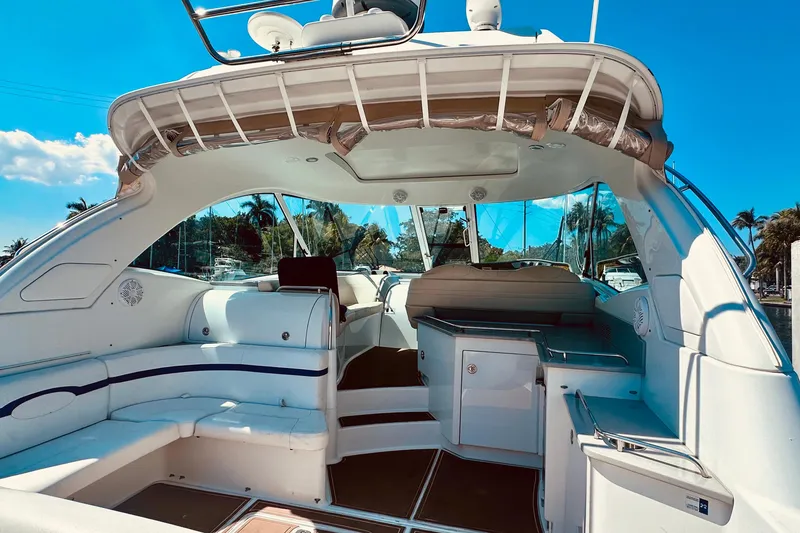 Slide: The Image of 2012 Formula 45 Yacht interior with white seating and sleek design under clear blue sky. - 10