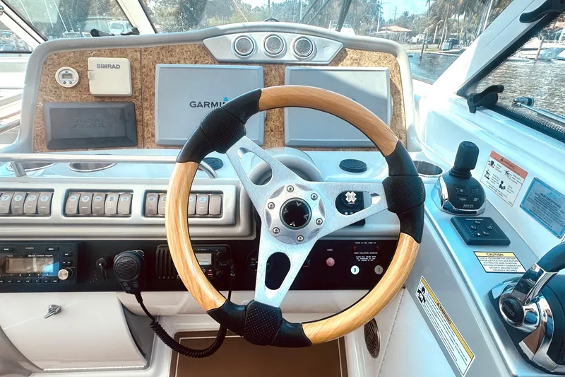 Slide: The Image of Steering wheel and dashboard of a 2012 Formula 45 Yacht with navigation equipment. - 11