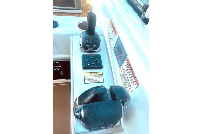Slide: The Image of Control panel of a 2012 Formula 45 Yacht with joystick and throttle. - 13