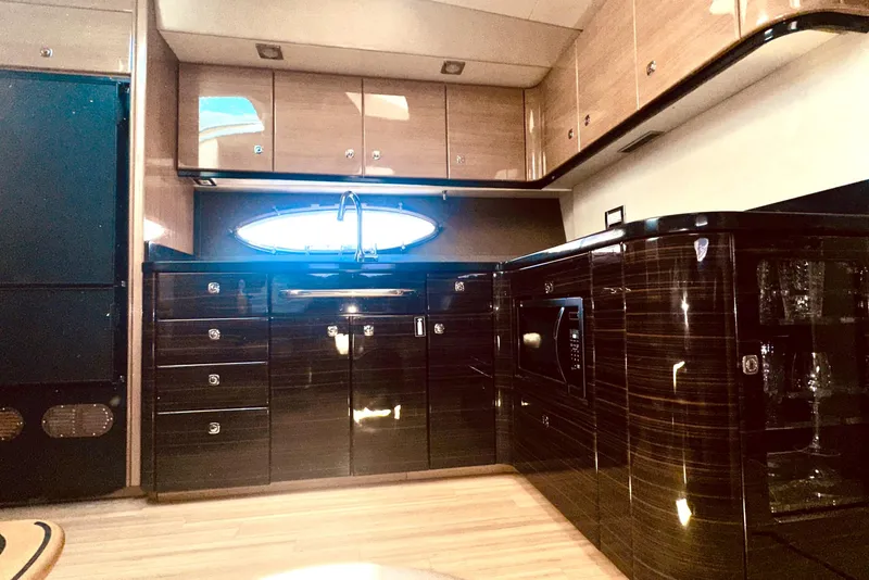 Slide: The Image of Luxurious kitchen interior of 2012 Formula 45 Yacht with sleek cabinetry and modern appliances. - 15