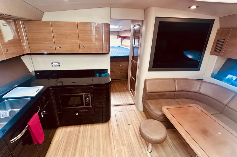 Slide: The Image of Luxurious interior of 2012 Formula 45 Yacht with kitchen, seating, and bedroom. - 16