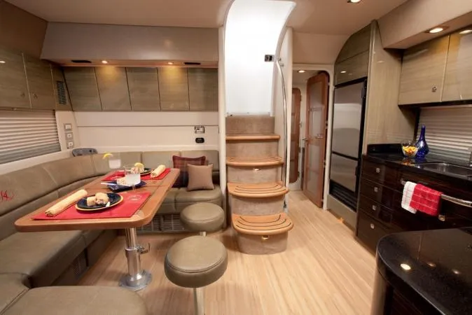 Slide: The Image of Manufacturer Provided Image: Interior of 2012 Formula 45 Yacht with dining area, kitchen, and staircase. - 18