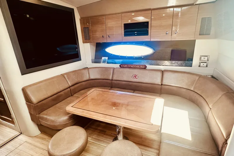 Slide: The Image of Luxurious interior of 2012 Formula 45 Yacht with leather seating and wooden table. - 19
