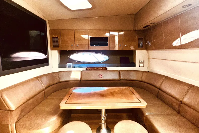 Slide: The Image of Luxurious interior of a 2012 Formula 45 Yacht with leather seating and wooden table. - 20