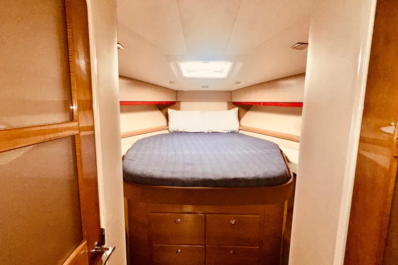 Slide: The Image of Luxurious cabin interior of 2012 Formula 45 Yacht with cozy bed and skylight. - 22