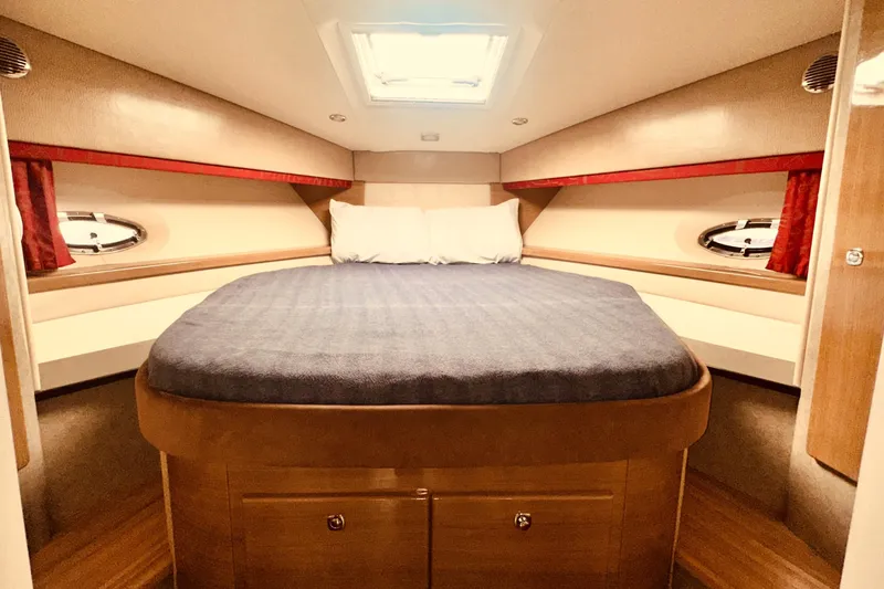 Slide: The Image of Luxurious cabin interior of a 2012 Formula 45 Yacht with cozy bedding and elegant design. - 23