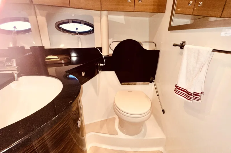 Slide: The Image of Luxurious bathroom in a 2012 Formula 45 Yacht with modern fixtures and elegant design. - 25