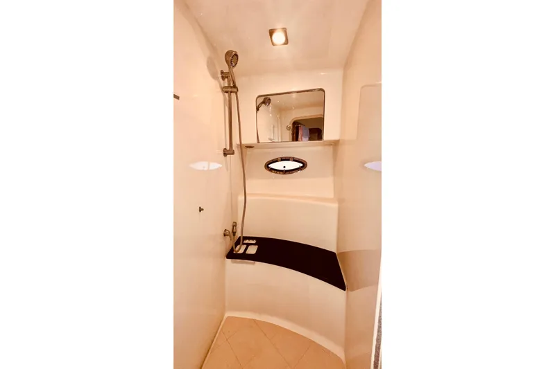 Slide: The Image of Interior shower of 2012 Formula 45 Yacht with modern fixtures and porthole window. - 27