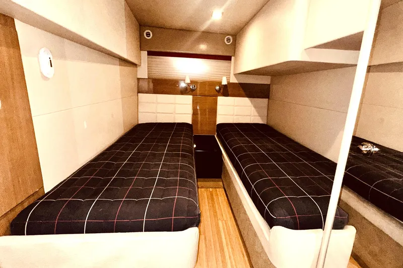 Slide: The Image of Luxurious interior cabin of a 2012 Formula 45 Yacht with twin beds and modern decor. - 28