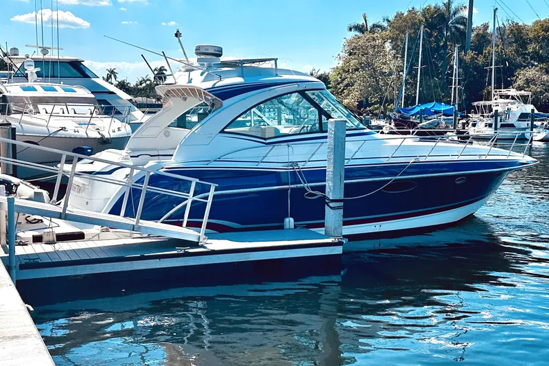 Slide: The Image of 2012 Formula 45 Yacht docked at marina under clear blue sky. - 3