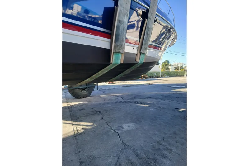 Slide: The Image of 2012 Formula 45 Yacht on dry dock, showcasing hull and lifting straps. - 33