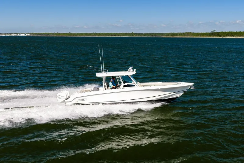 The Image of 2018 Boston Whaler 380 Outrage cruising on open water. - 0