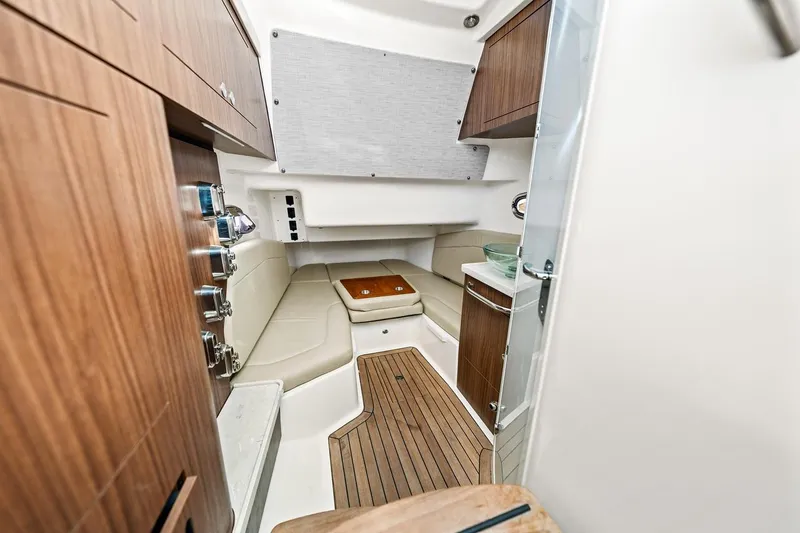 Slide: The Image of Luxurious interior of 2018 Boston Whaler 380 Outrage with wood accents and seating. - 31