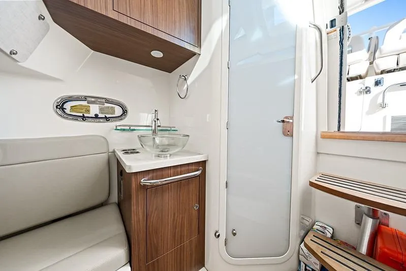 Slide: The Image of Luxurious interior of 2018 Boston Whaler 380 Outrage boat, featuring modern bathroom amenities. - 33