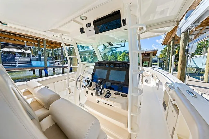 Slide: The Image of 2018 Boston Whaler 380 Outrage boat interior with advanced navigation system and luxurious seating. - 36