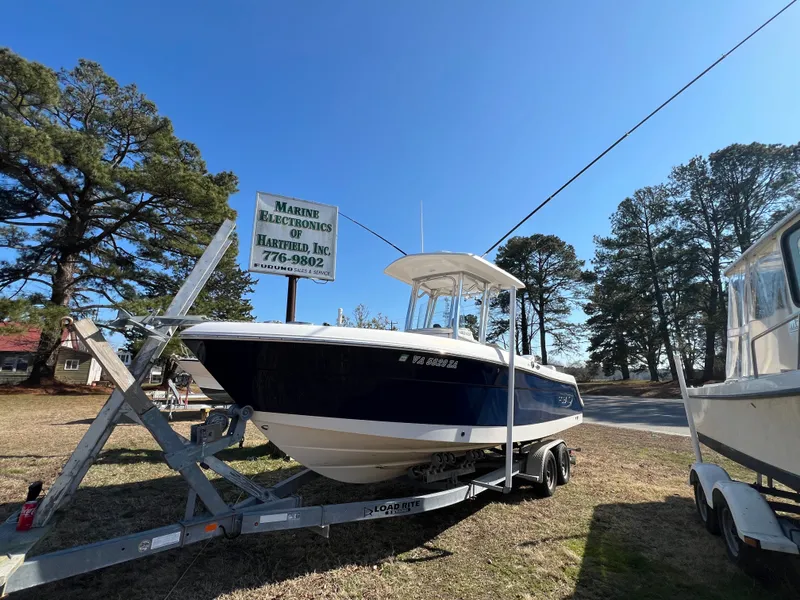 The Image of 2020 Robalo R242 Center Console boat on trailer outdoors. - 0
