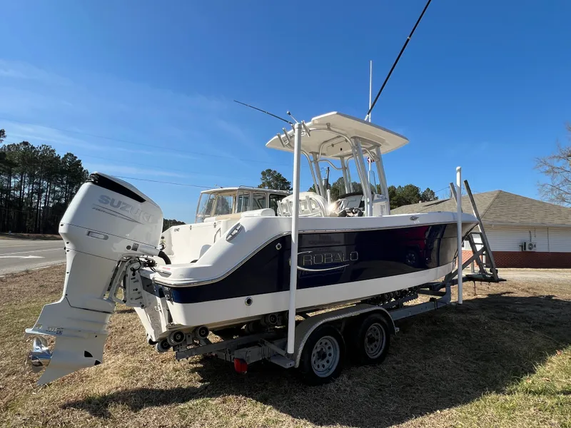 Slide: The Image of 2020 Robalo R242 Center Console boat on trailer. - 3