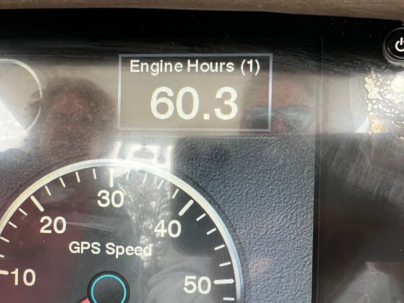 Slide: The Image of Robalo R242 boat display showing 60.3 engine hours. - 4