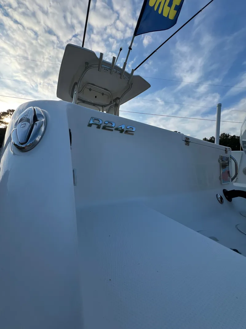 Slide: The Image of 2020 Robalo R242 Center Console with sleek design and spacious deck. - 31