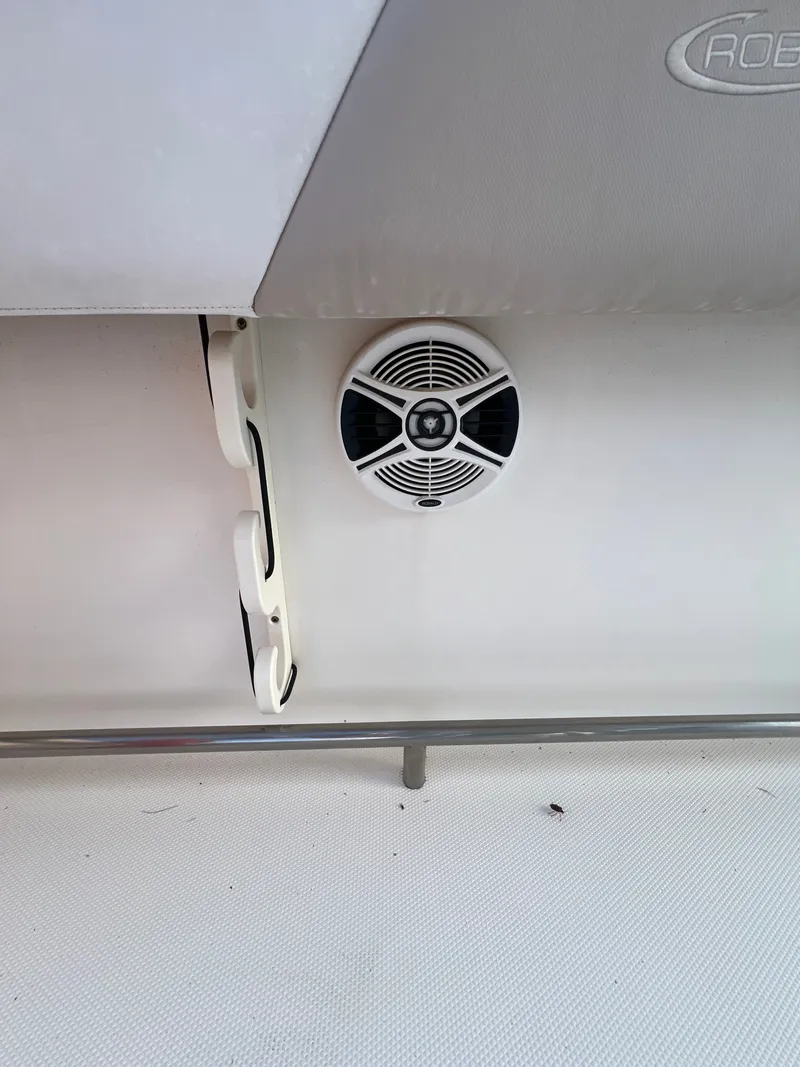 Slide: The Image of Speaker and holders on the interior wall of a 2020 Robalo R242 Center Console boat. - 40