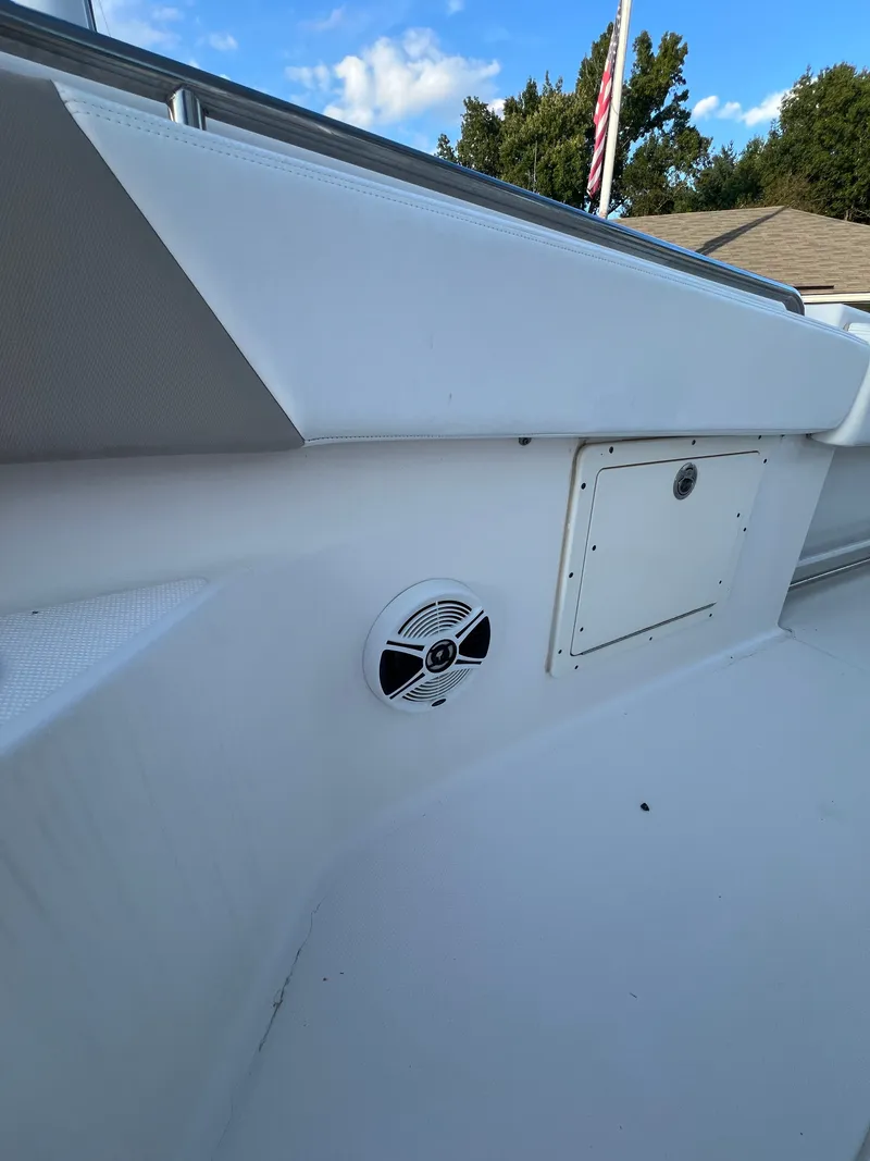 Slide: The Image of Close-up of a 2020 Robalo R242 Center Console boat interior with a speaker. - 37