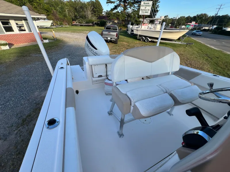 Slide: The Image of The image shows the cockpit of a 2020 Robalo R242 Center Console boat. - 27