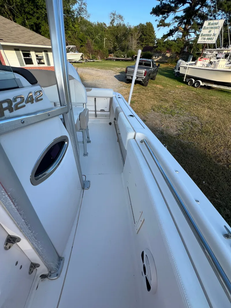 Slide: The Image of The image shows the deck of a 2020 Robalo R242 Center Console boat. - 25