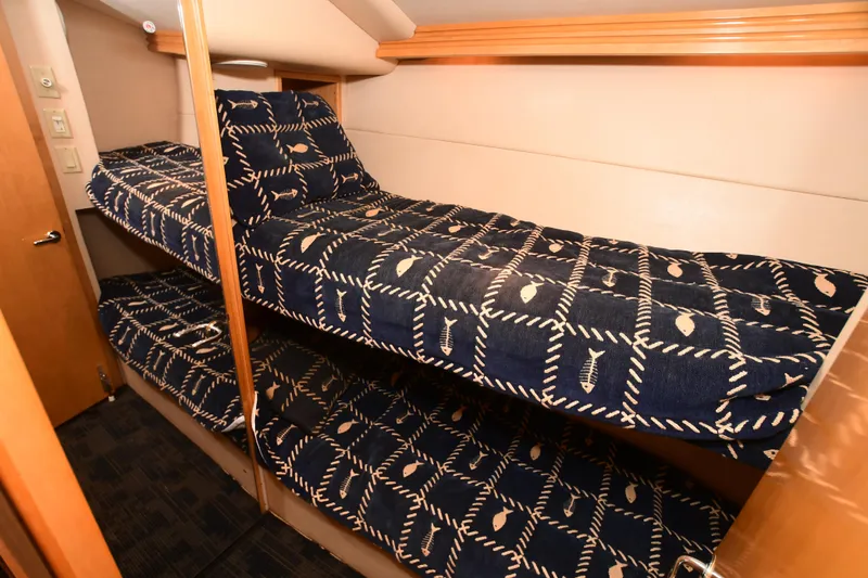 Slide: The Image of Bunk beds in a 2001 Hatteras 50 Convertible yacht cabin. - 14