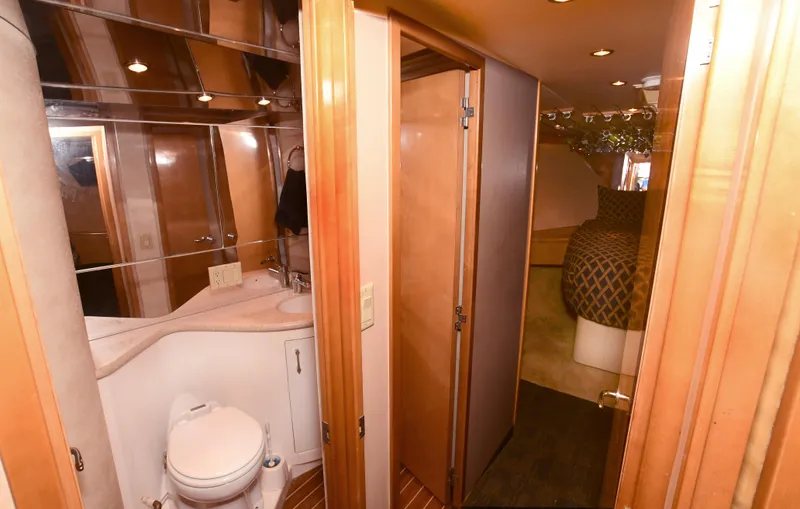 Slide: The Image of Interior of 2001 Hatteras 50 Convertible yacht featuring bathroom and bedroom. - 20