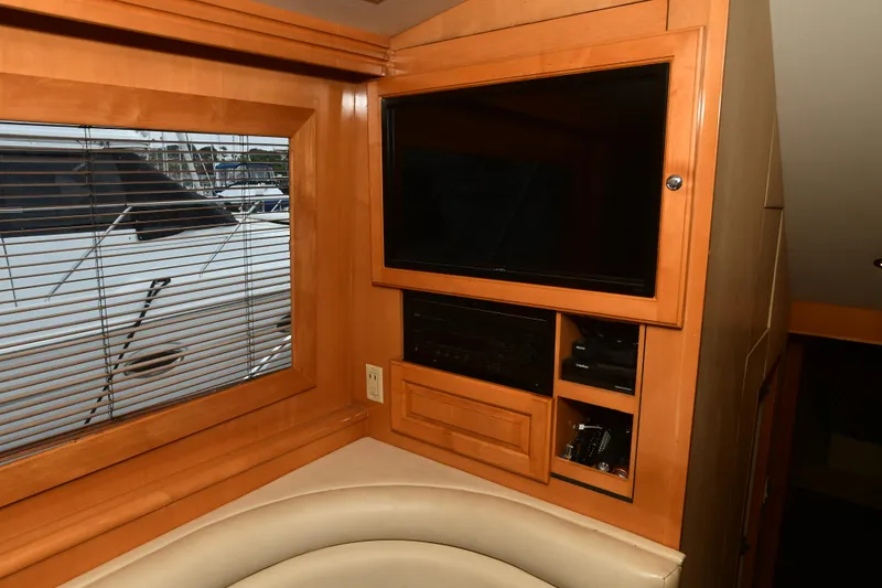 Slide: The Image of Interior of 2001 Hatteras 50 Convertible with TV and window. - 23