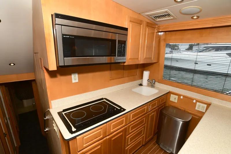 Slide: The Image of Kitchen of 2001 Hatteras 50 Convertible yacht. - 24