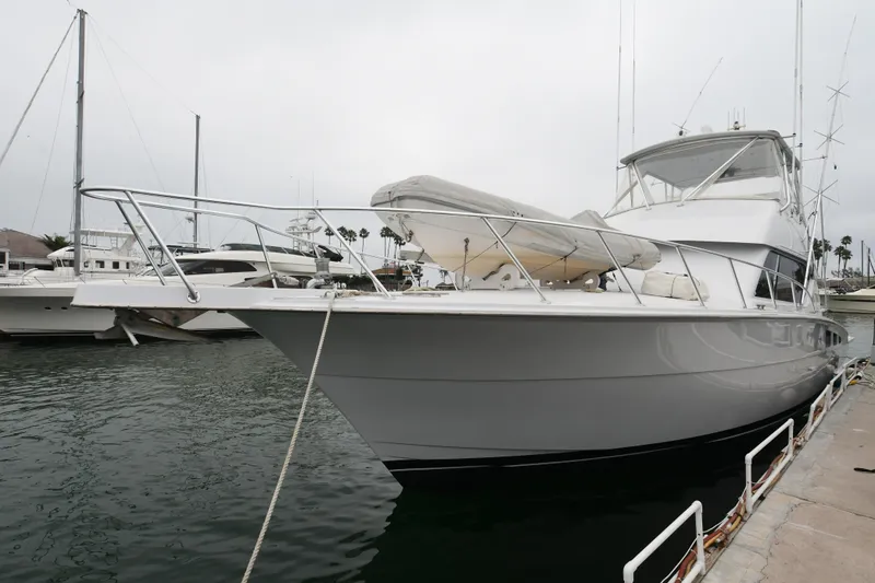 Slide: The Image of 2001 Hatteras 50 Convertible yacht docked at marina. - 3