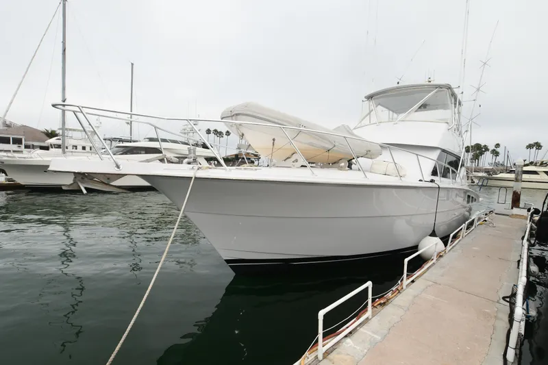 Slide: The Image of 2001 Hatteras 50 Convertible yacht docked at marina. - 39