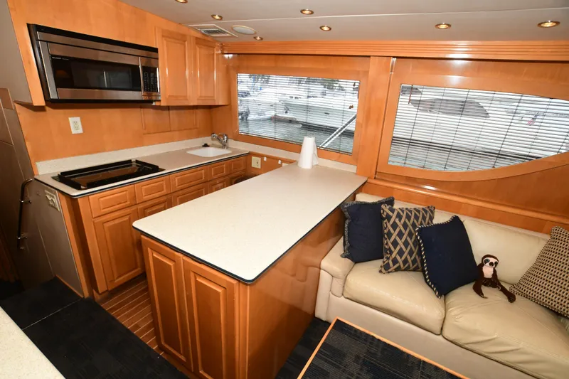 Slide: The Image of Interior of 2001 Hatteras 50 Convertible yacht with kitchen and sofa. - 9