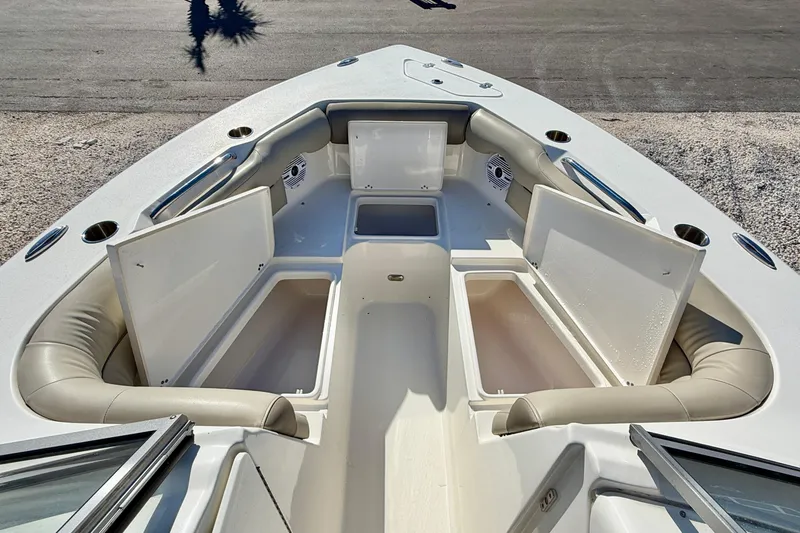 Slide: The Image of 2023 Key West 239 DFS boat interior with open storage compartments and seating. - 10