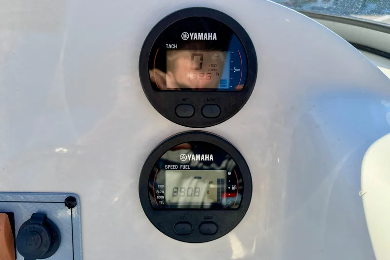 Slide: The Image of Yamaha gauges on 2023 Key West 239 DFS boat dashboard, displaying tachometer and speed fuel readings. - 17